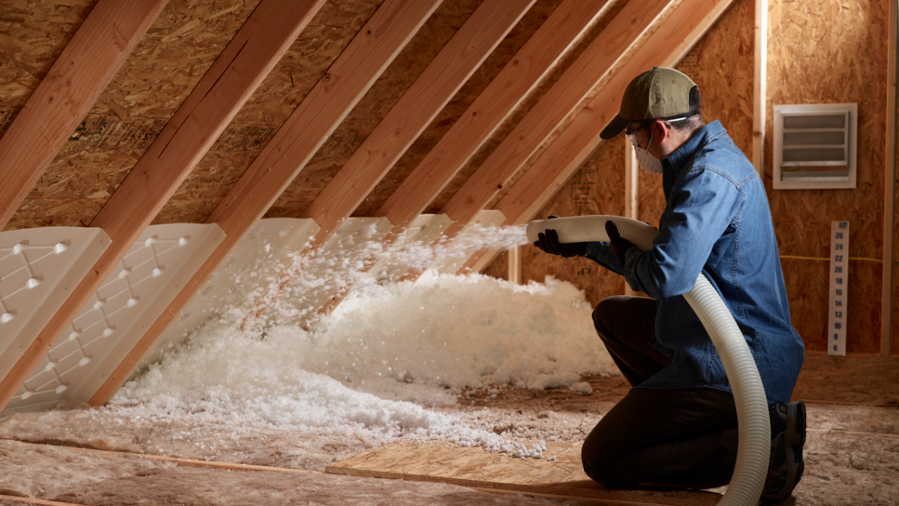 Blown-in attic insulation being installed by All Season Air Care